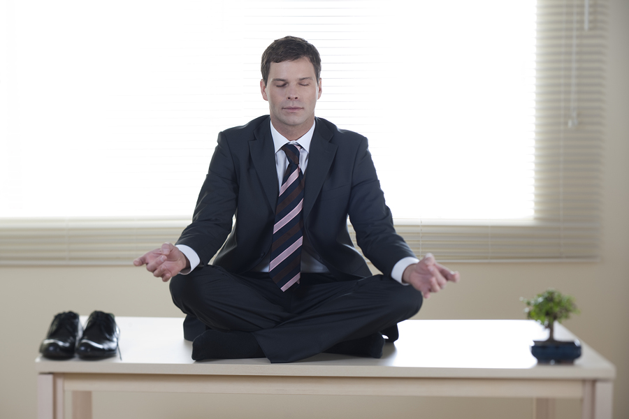 project-manager-meditating-on-desk
